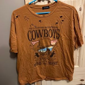 “This country needs more cowboys” tshirt